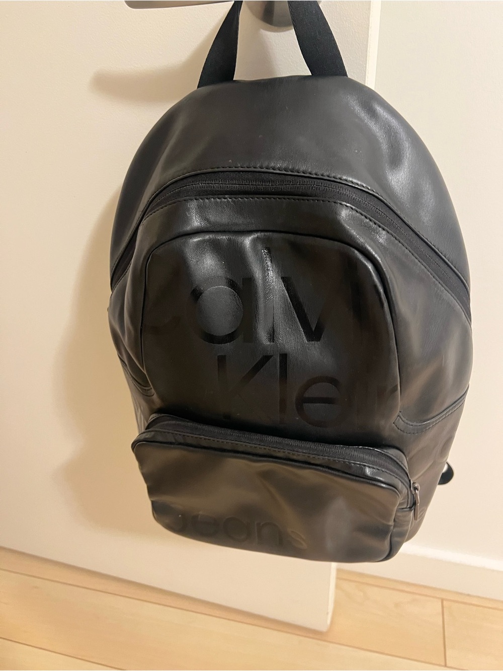 Calvin Klein Matte Black Leather Backpack with Front Zip Pocket